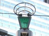 渋谷道玄坂上の夕闇迫る中、かすかに時計だと自己表示。05.11.19.